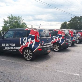 Fleet of fully wrapped Kia Souls for a driving school.