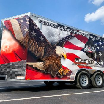 Patriotic themed full wrap on a trailer with eagle soaring in front of a US flag.