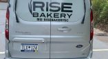 Custom window perf the rear of Rise Bakery's van.