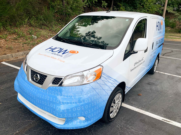 Full wrap on a van for a technology company with a 010 techy pattern.