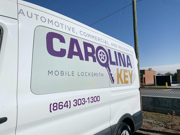 Carolina Key logo on window perf with cut graphics above and below.