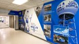 Hallway wall mural with photos and captions from WYFF's time in Greenville.