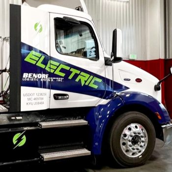 Day cab electric vehicle graphics on a Benore truck.