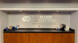 Dimensional lettering of the Blood Connection logo above conference room bar.