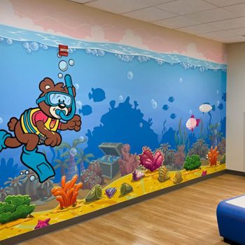 Underwater themed mural in children's hospital waiting room.