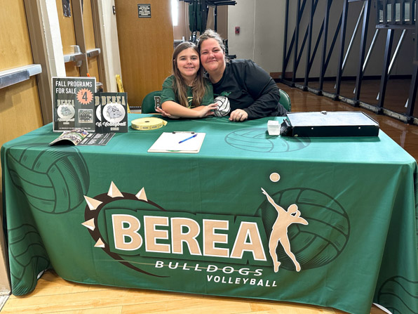 Regular table throw printed green with volleyballs and the Berea Bulldogs Volleyball logo