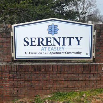 Updated acm monument signage with custom shape at the entrance to Serenity at Easley apartments