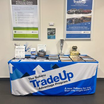 Fitted table throw with angled pattern for Fairway Ford's Trade Up program