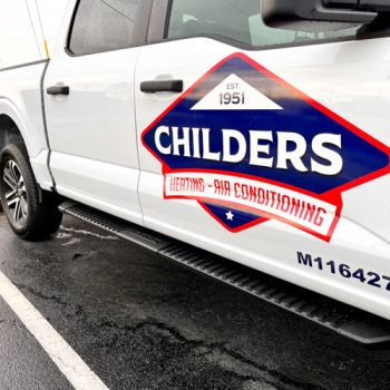 Childers logo decal on door of white truck