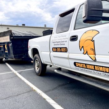 Logo and services decals on truck and dump trailer for Sparta Junk Removal