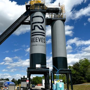 Large black logo on 40+ foot tall silo for Reeves