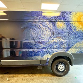 Starry Night wrap installed on driver's side of a promaster van