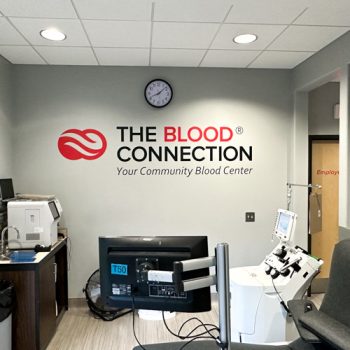 The Blood Connection logo in vinyl on wall in donation room.