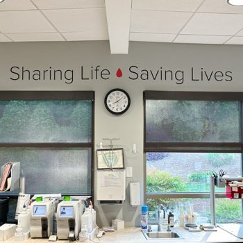 Sharing Life - Saving Lives quote above nurse's station at The Blood Connection on Woodruff Rd. in Greenville, SC
