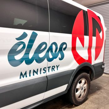 Custom cut logo graphics on an extended transit van for the Lead Collective