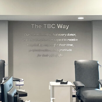 The TBC Way (commitment statement) in brushed aluminum dimensional lettering on wall at The Blood Connection in Anderson, SC