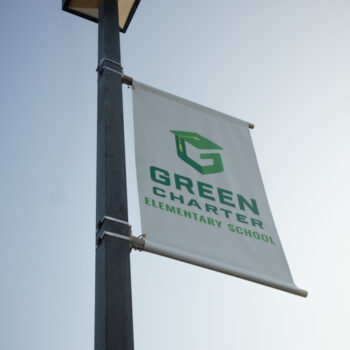Pole banners showcasing school logo and colors for Green Charter Middle School in Greenville, SC