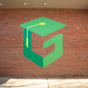 Large G logo mural on brick at Green Charter Elementary School in Greenville, SC