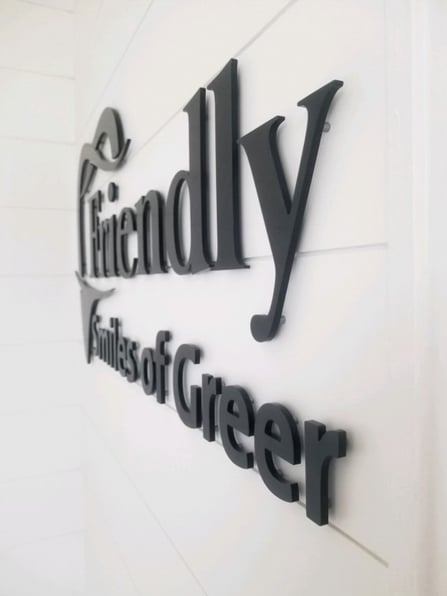 Black acrylic lettering for a dentist office.