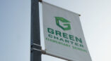 Pole banners showcasing school logo and colors for Green Charter Middle School in Greenville, SC