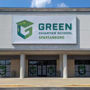 Super-format banner used as storefront sign for Green Charter School of Spartanburg, SC