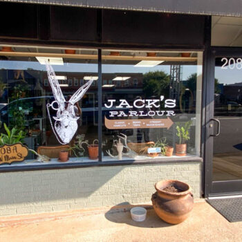 Detailed vinyl rabbit and business name on storefront windows for Jack's Parlour in Easley, SC