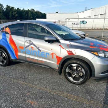 Custom paint splashes and logo graphics on Painter 1's sales vehicle