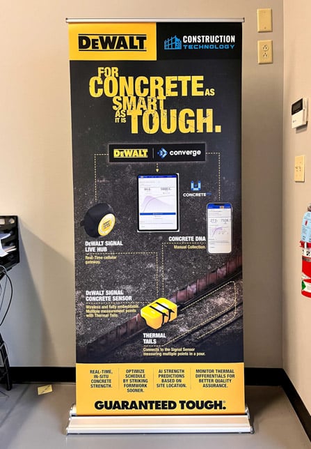 Retractable banner stand with infographic of products and uses for DeWALT