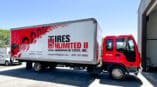 Full red, white and black box and cab wrap for large box truck in Tires Unlimited II's fleet in Greer, SC