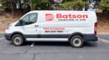 Orange and black spot graphics on fleet van for Batson Heating & Air