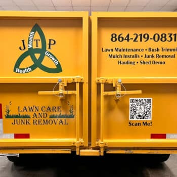 Custom logo and services decals on a yellow dump trailer for JTP Lawn Care and Junk Removal