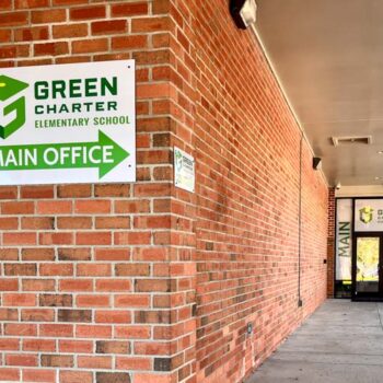 Outdoor ACM directional signage pointing to the front office of Green Charter Elementary School in Greenville, SC