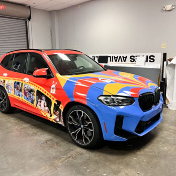 Full wrap for Ronald McDonald House Charities featuring images of smiling children and bright, red blue and yellow colors.