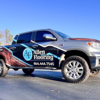 Partial vehicle wrap with business info and wood grain pattern for Allen Flooring in Greenville, SC