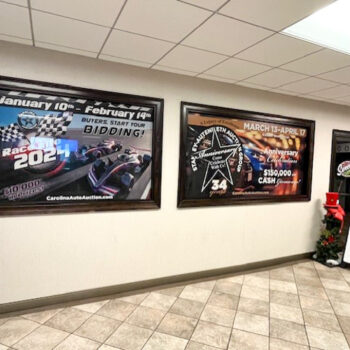 Interior window perf graphics covering office windows in lobby at CAA in Greenville, SC