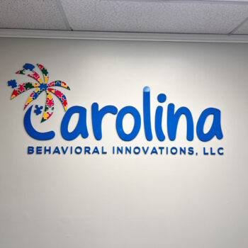 Business logo fabricated with dimensional acrylic letters and puzzle pieces for Carolina Behavioral Innovations in Greenville, SC