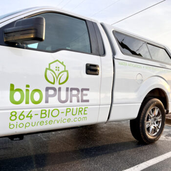 Simple logo, contact and services info in vinyl on a BioPure franchisee's new white truck in Greenville, SC