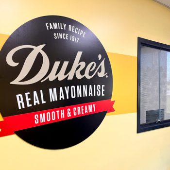 Ultraboard Duke's Mayo logo on wall inside Sauer Brand's lobby in Greenville, SC