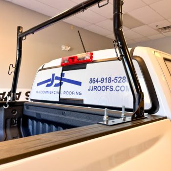 Custom window perf on rear and back sides of work truck in Greenville, SC