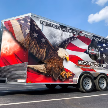 Patriotic themed wrap on a trailer with eagle soaring in front of a US flag with services and contact info superimposed for Patriot Performance Products.
