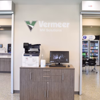 Custom logo wall decal above printer in cafeteria in Vermeer's Piedmont, SC facility.