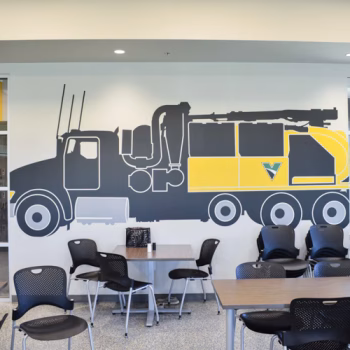 Large vinyl wall decal of a Vermeer truck in the cafeteria at Vermeer's Piedmont, SC facility.