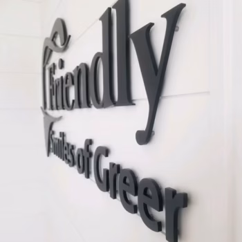 Black acrylic lettering spaced slightly off the wall for affect at Friendly Smiles of Greer.