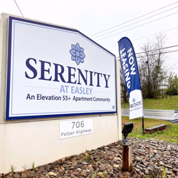 Updated acm monument signage with custom shape at the entrance to Serenity at Easley apartments