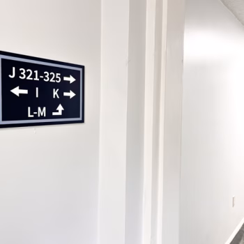 Directional signage made with acrylic and raised lettering for Serenity at Easley apartments
