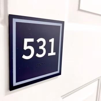 Apartment room plaque made with acrylic and raised letters with braille for Serenity at Easley apartments