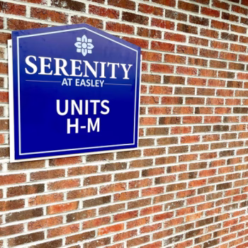 ACM building signage indicating a section of units from H-M for Serenity at Easley apartments