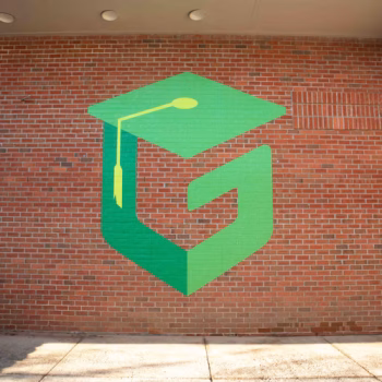 Large vinyl logo mural on brick at Green Charter Elementary School in Greenville, SC