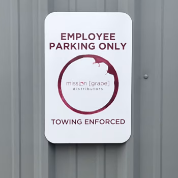 Custom parking sign on corrugated building side for Mission Grape in Greenville, SC.