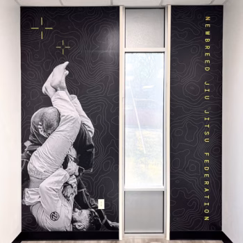 Removable wall mural showcasing jiu jitsu fight in lobby at Newbreed in Greenville, SC